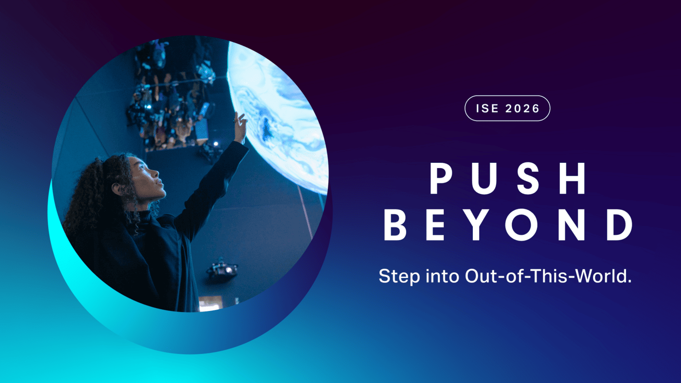 ISE 2026 Push Beynond Banner Eine Person zeigt auf eine leuchtende Kugel mit dem Text: ISE 2026, PUSH BEYOND, Step into Out-of-This-World auf einem Hintergrund mit blauem und violettem Farbverlauf.